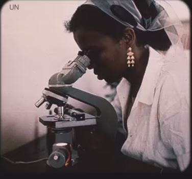 Woman with microscope 100